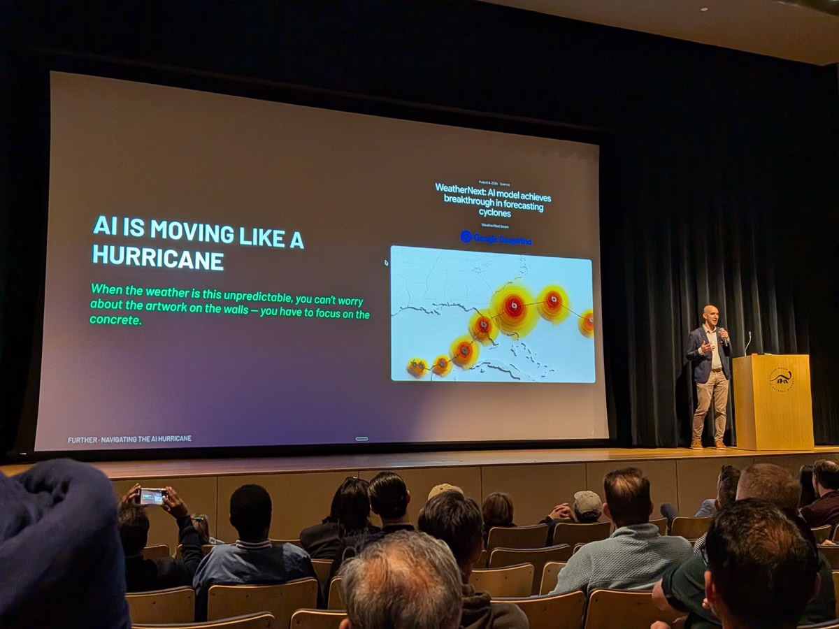 Jason Tabeling speaks beside a slide reading AI is moving like a hurricane at the Cleveland Museum of Natural History.